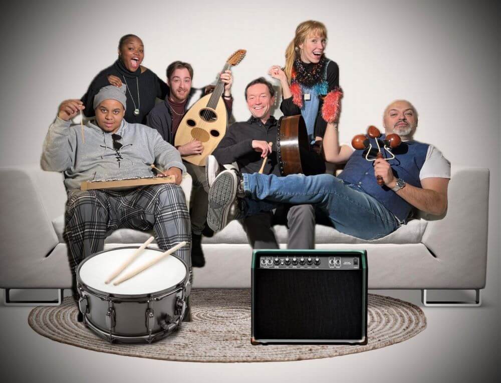 photoshopped-collage-of-six-band-members sitting-on-or-standing-behind-a-couch