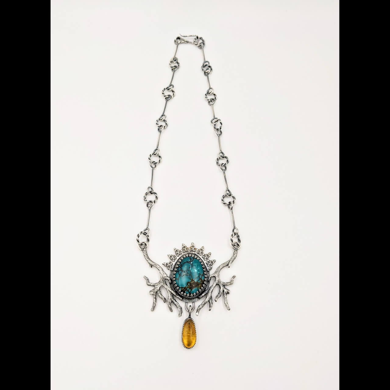 silver necklace with teal stone