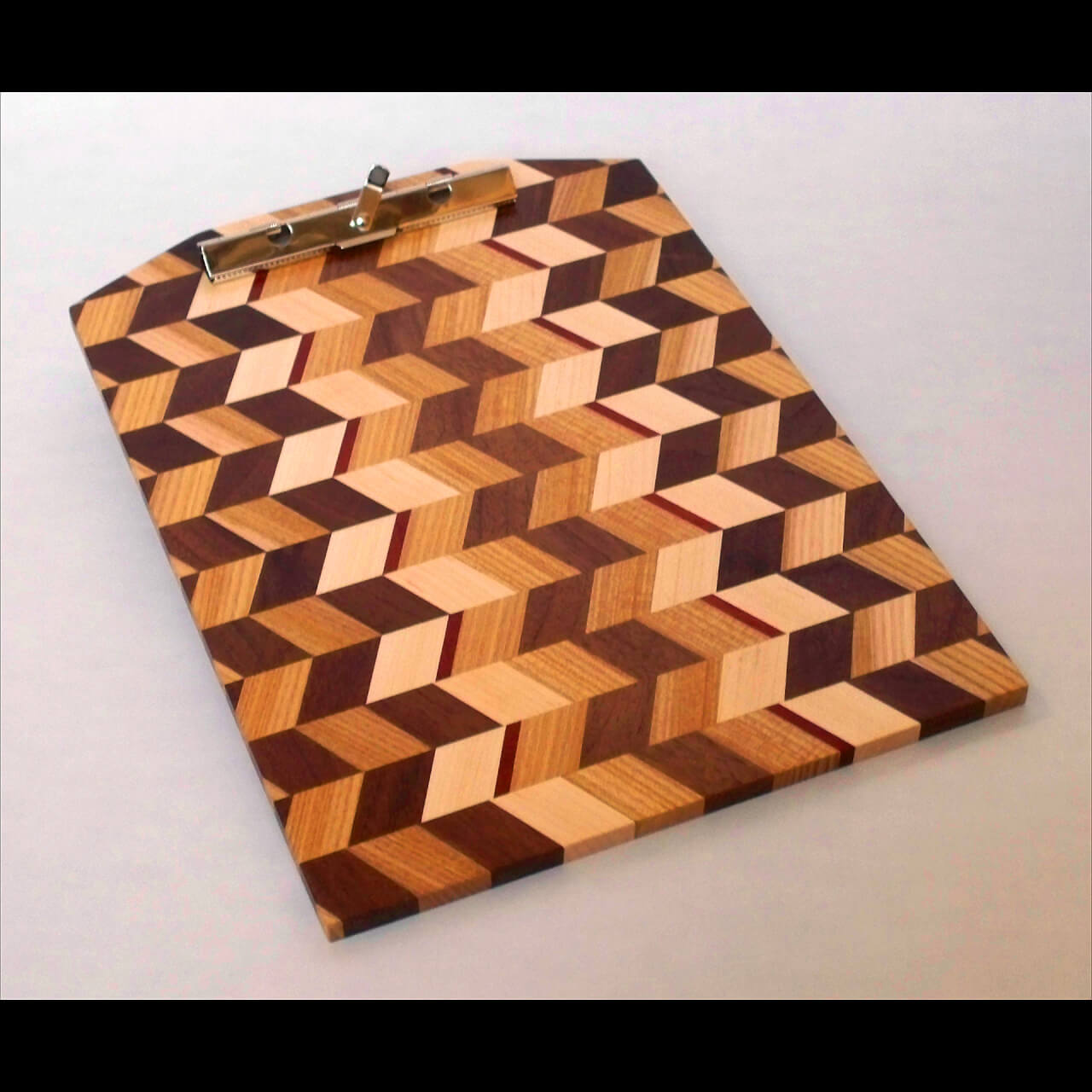 wooden cutting board with multiple colors creating dynamic diamond shapes