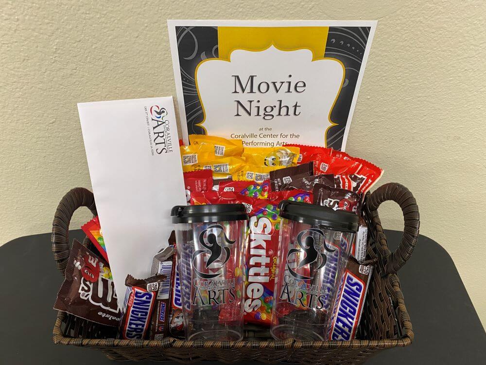 basket with movie candy and two CCPA branded reusable cups