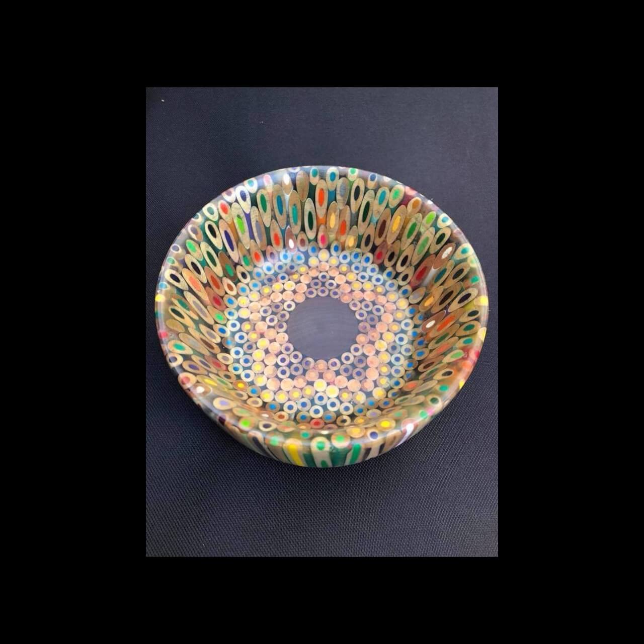 turned wooden bowl made from colored pencils