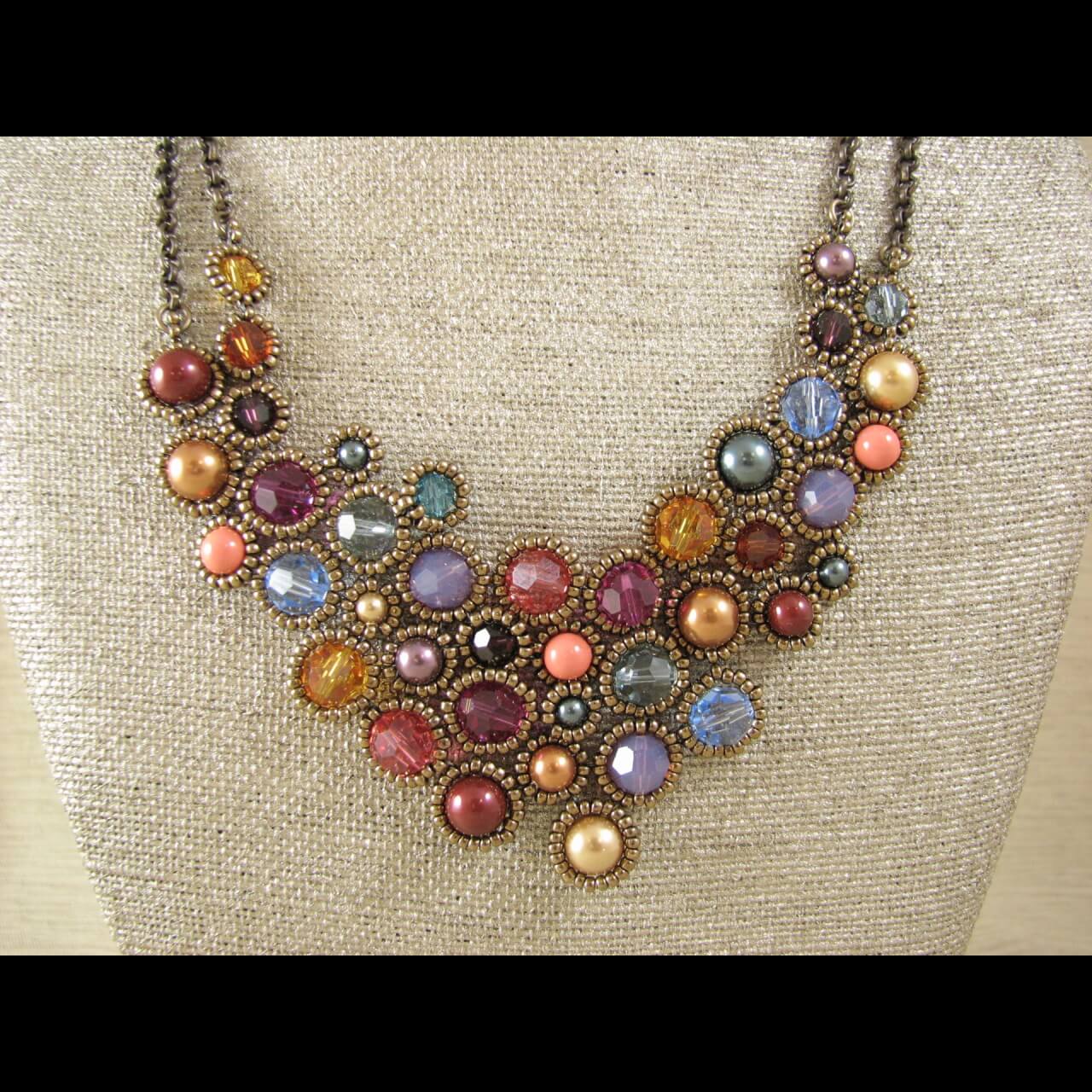 necklace made of small glass beads cased in metal