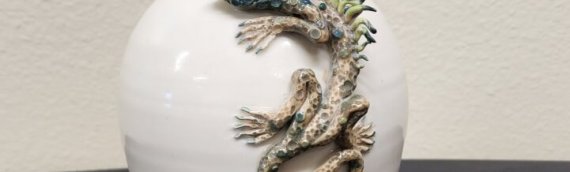 Ceramic vase with hand sculpted lizard