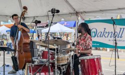 mj group with cello and drums on 2024 iowa city jazz festival side stage