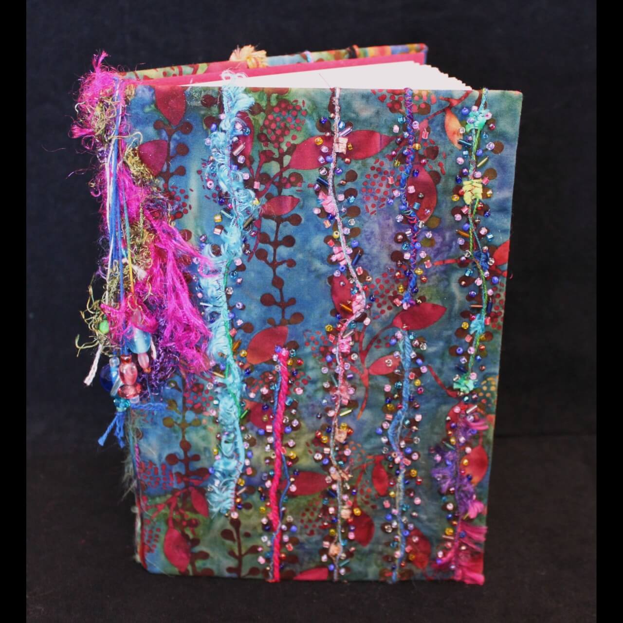 blank book covered in colorful fabric
