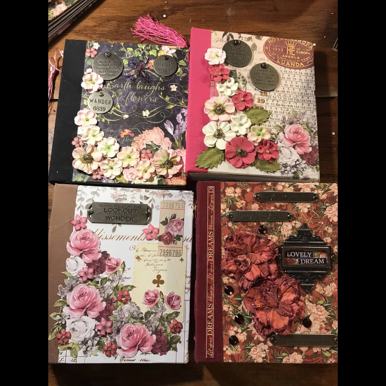 four handmade journals all with floral covers