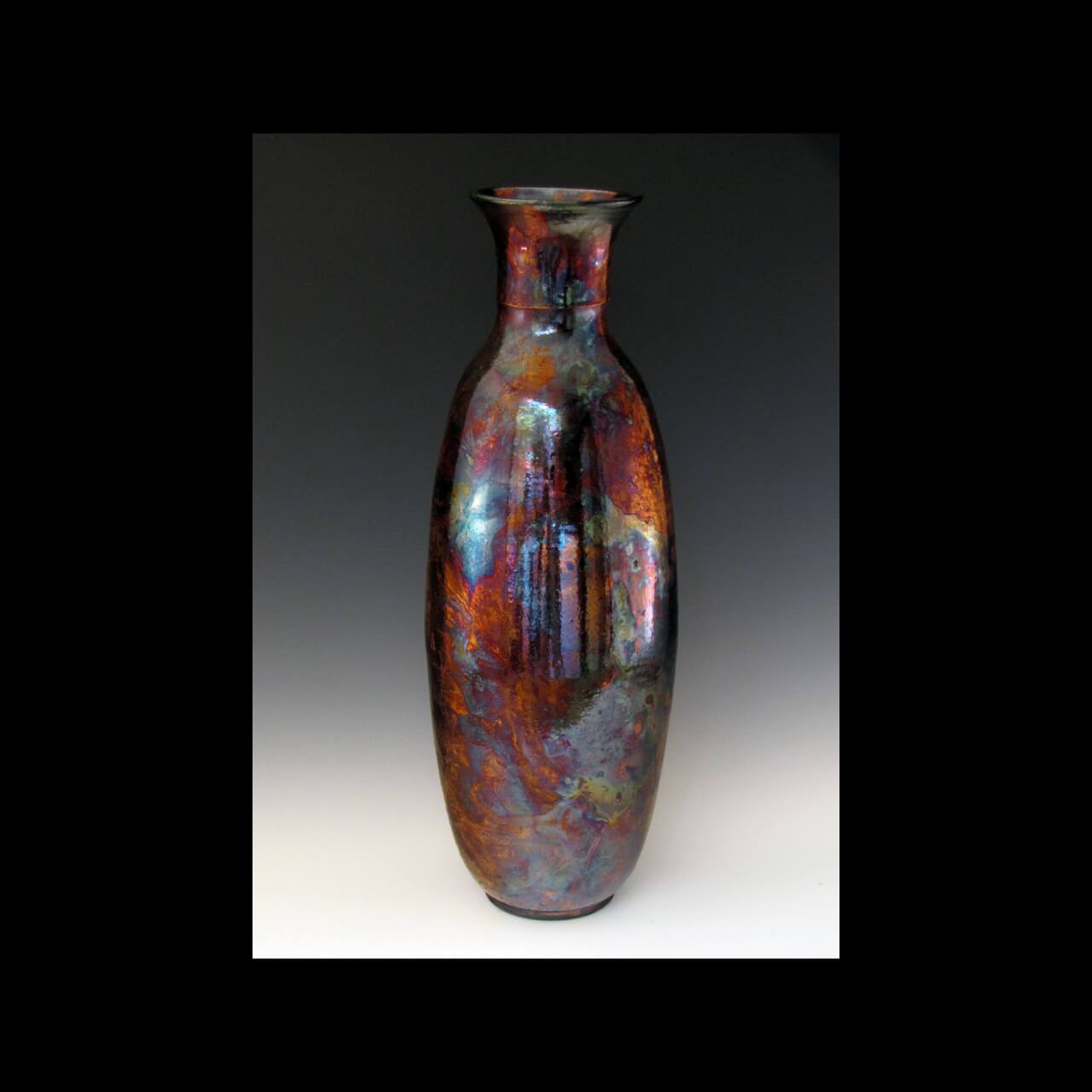 a vase with multicolored metallic glaze