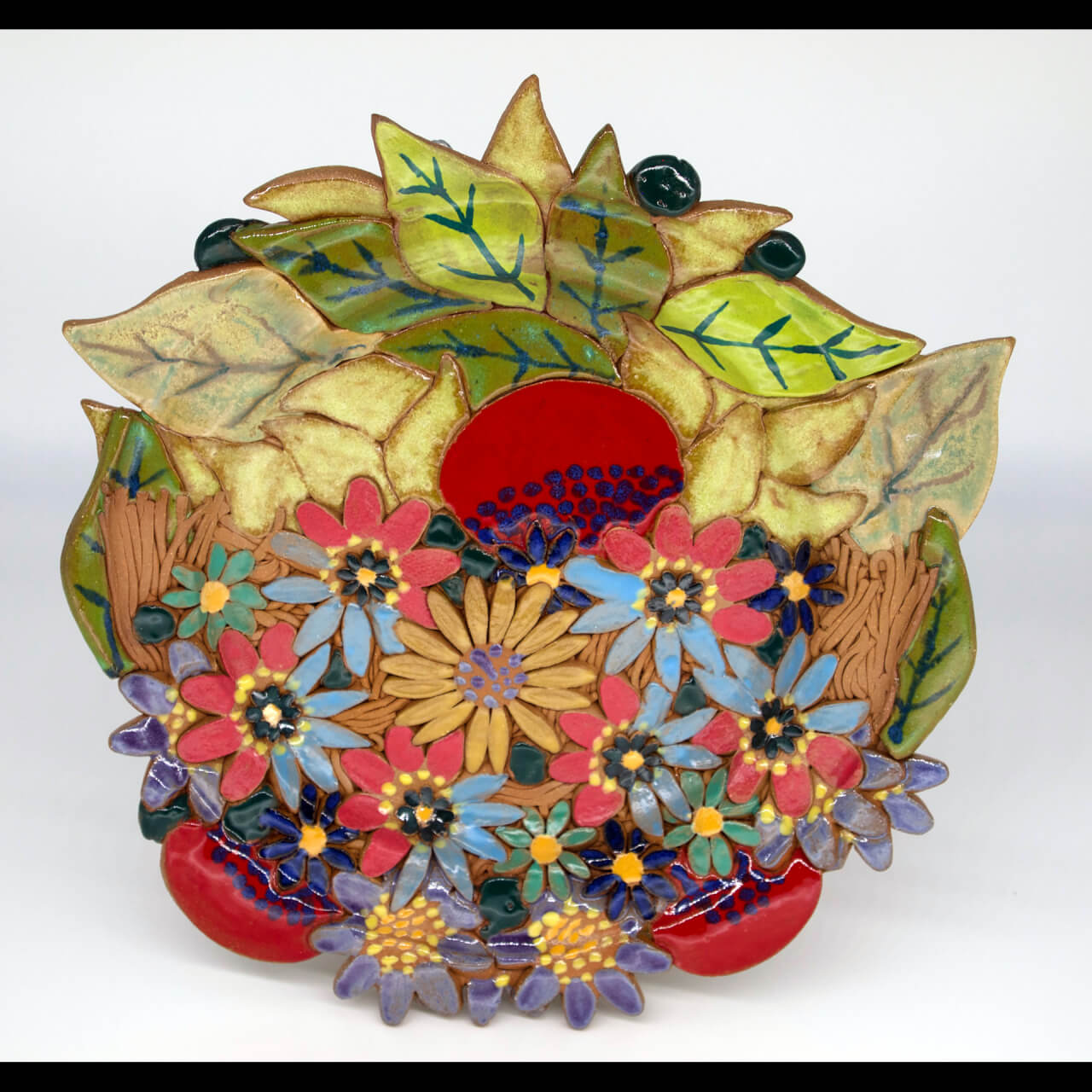 ceramic bowl painted in bright colors with floral theme