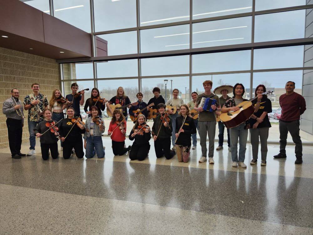 solo-high-school-mariachi-band-in-school-atrium-posed-with-instruments
