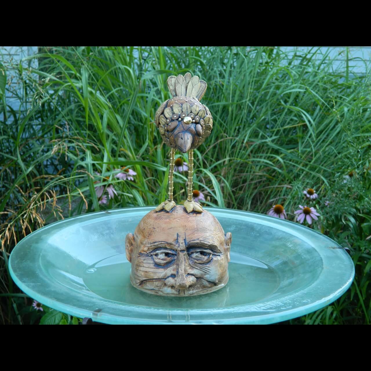 ceramic head in bird bath